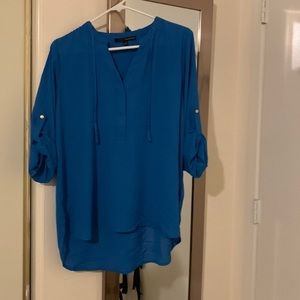 Royal blue Tunic blouse with 3/4 length sleeve.